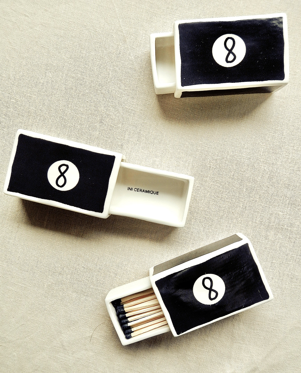 Hand-illustrated ceramic matchbox with 8 Ball illustration
