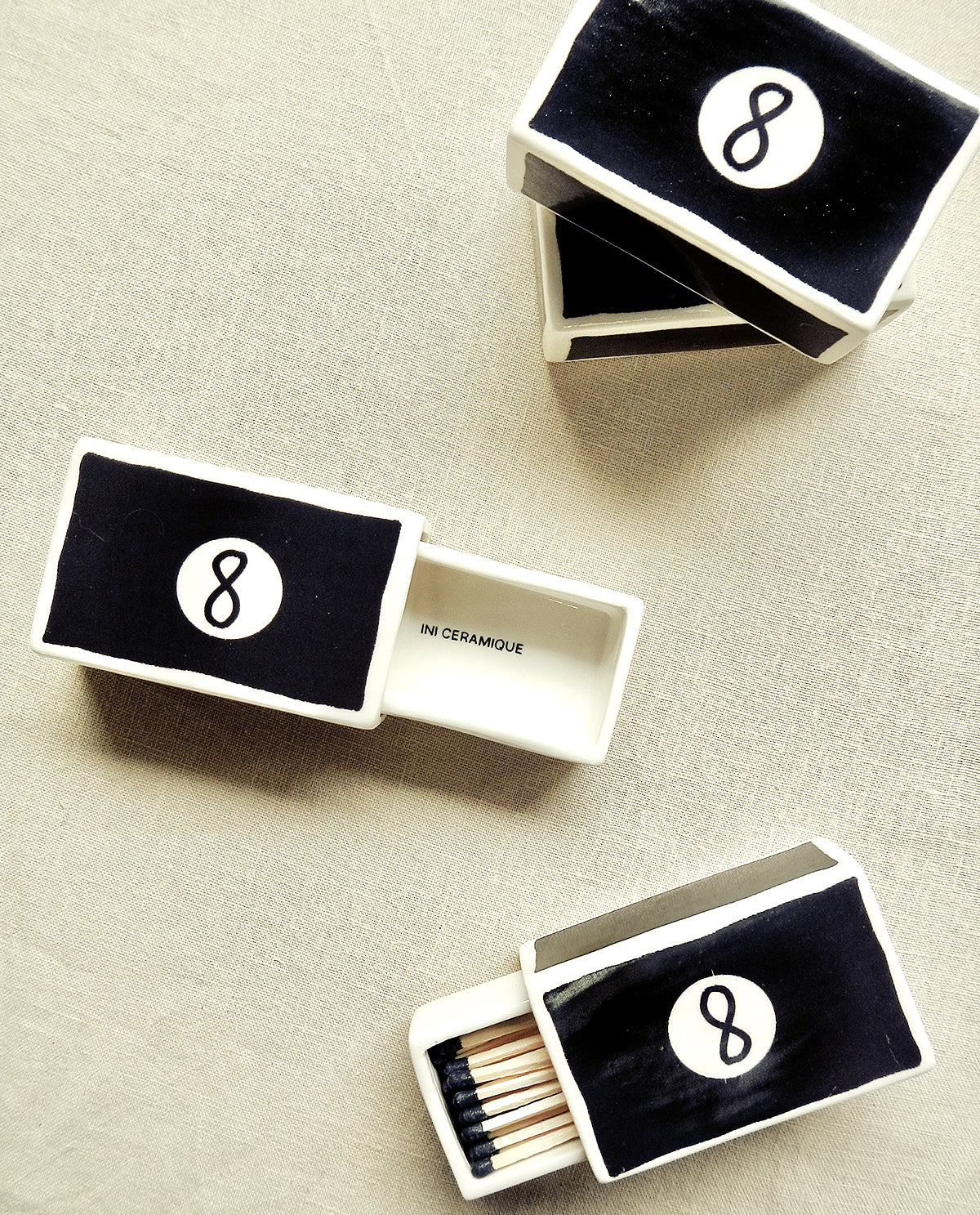 Hand-illustrated ceramic matchbox with 8 Ball illustration