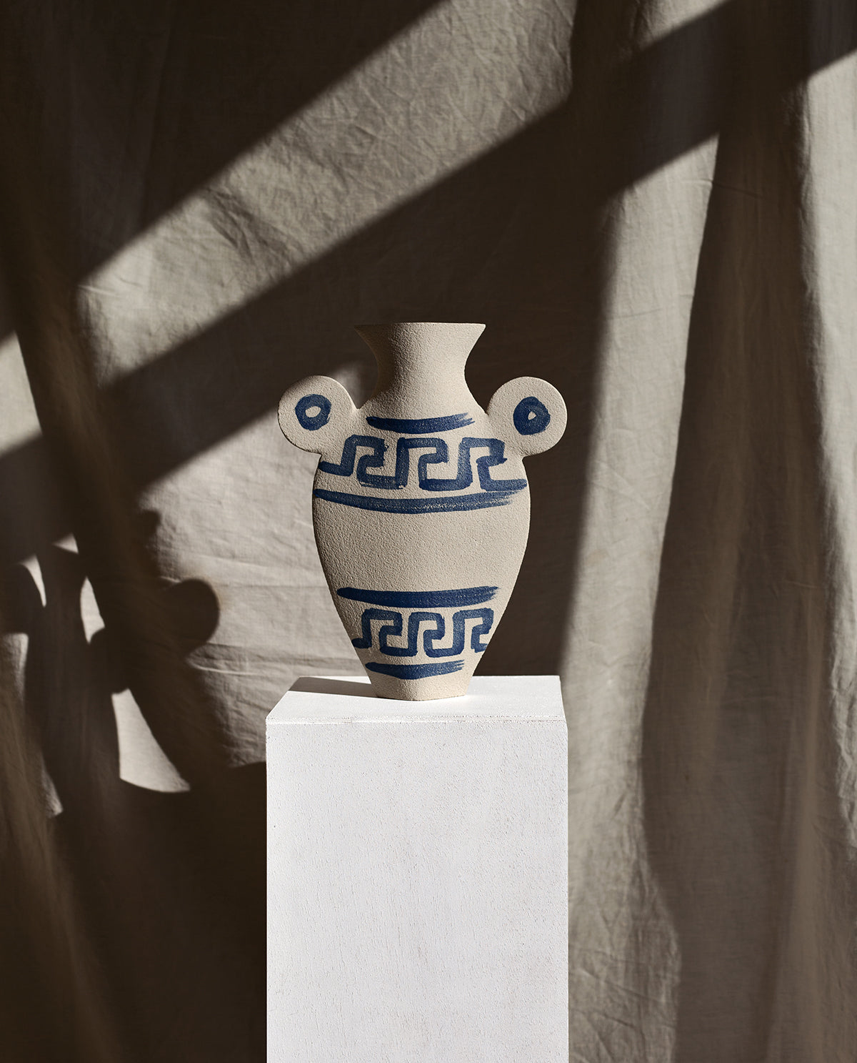 Hand-painted greek vase by INI CERAMIQUE with geometric patterns and textured finish