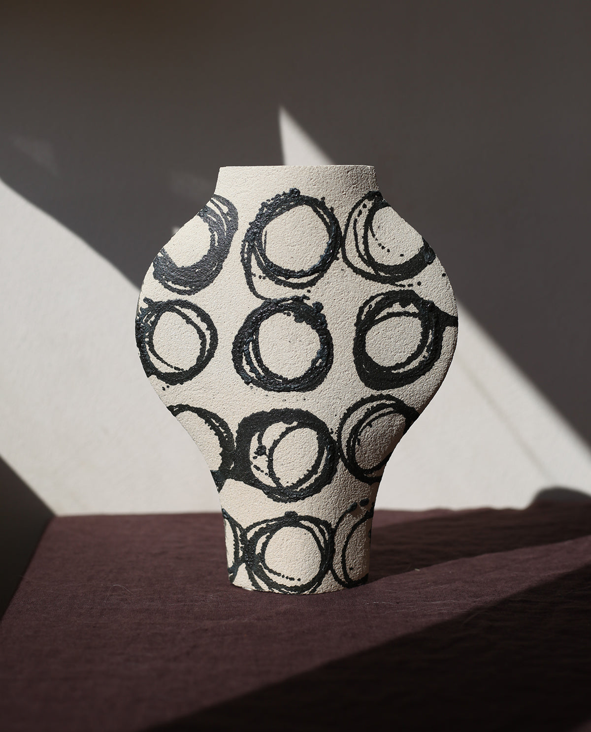 Hand-painted abstract vase by INI CERAMIQUE with geometric patterns and textured finish