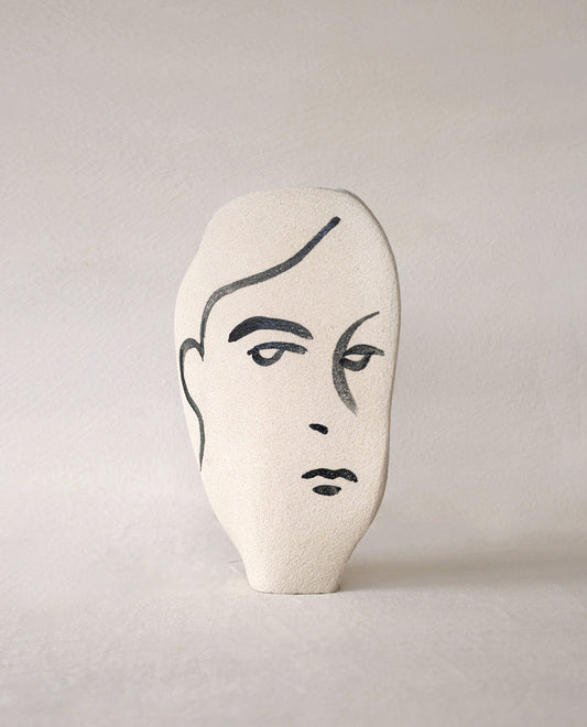 Hand-painted face vase by INI CERAMIQUE with illustrative patterns and a textured finish