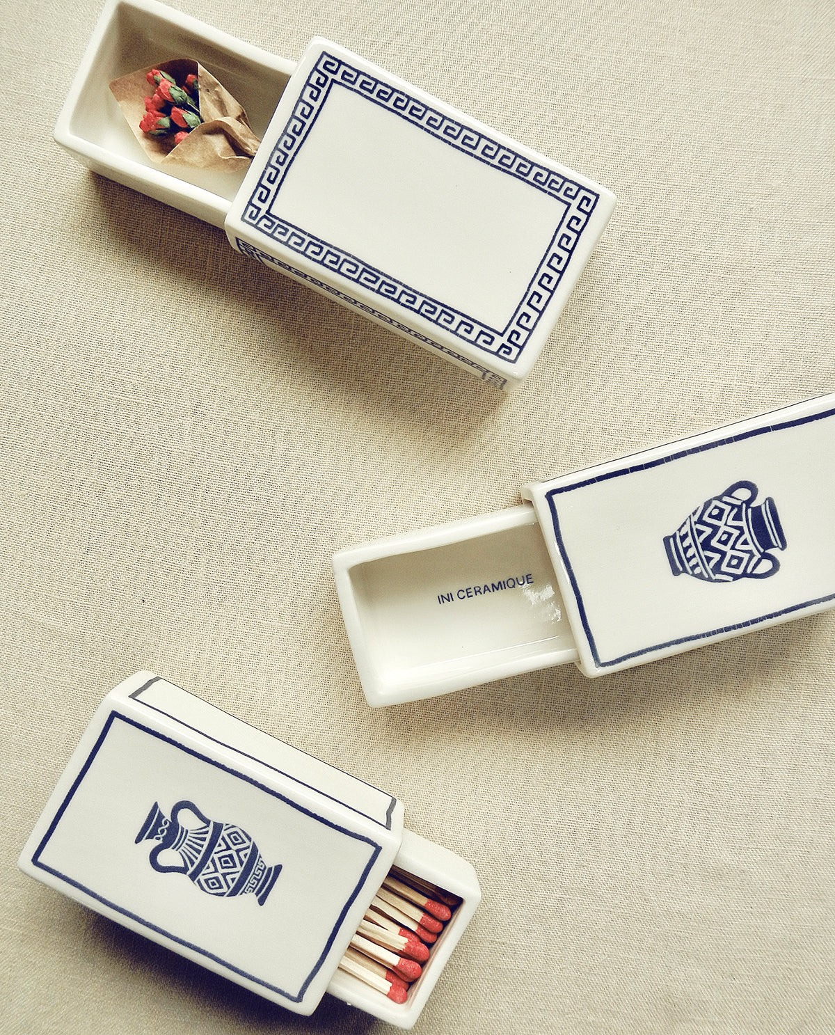 Hand-illustrated ceramic matchbox with Greek pattern design