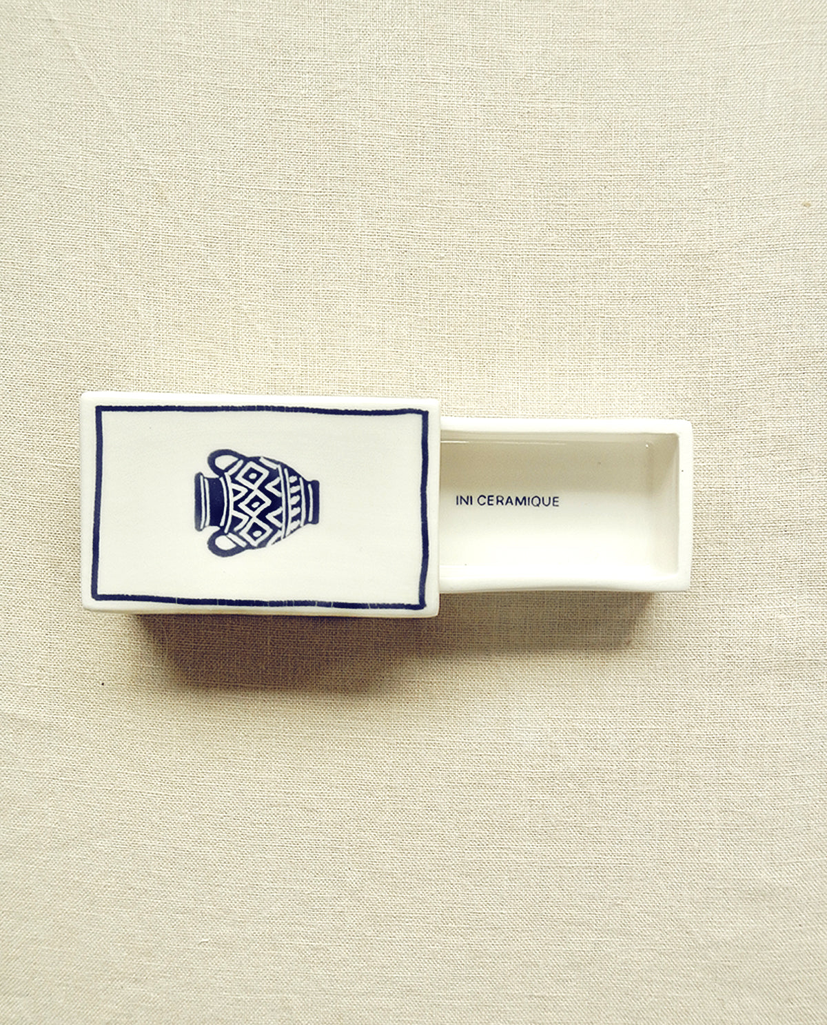 Hand-illustrated ceramic matchbox with greek vase illustration