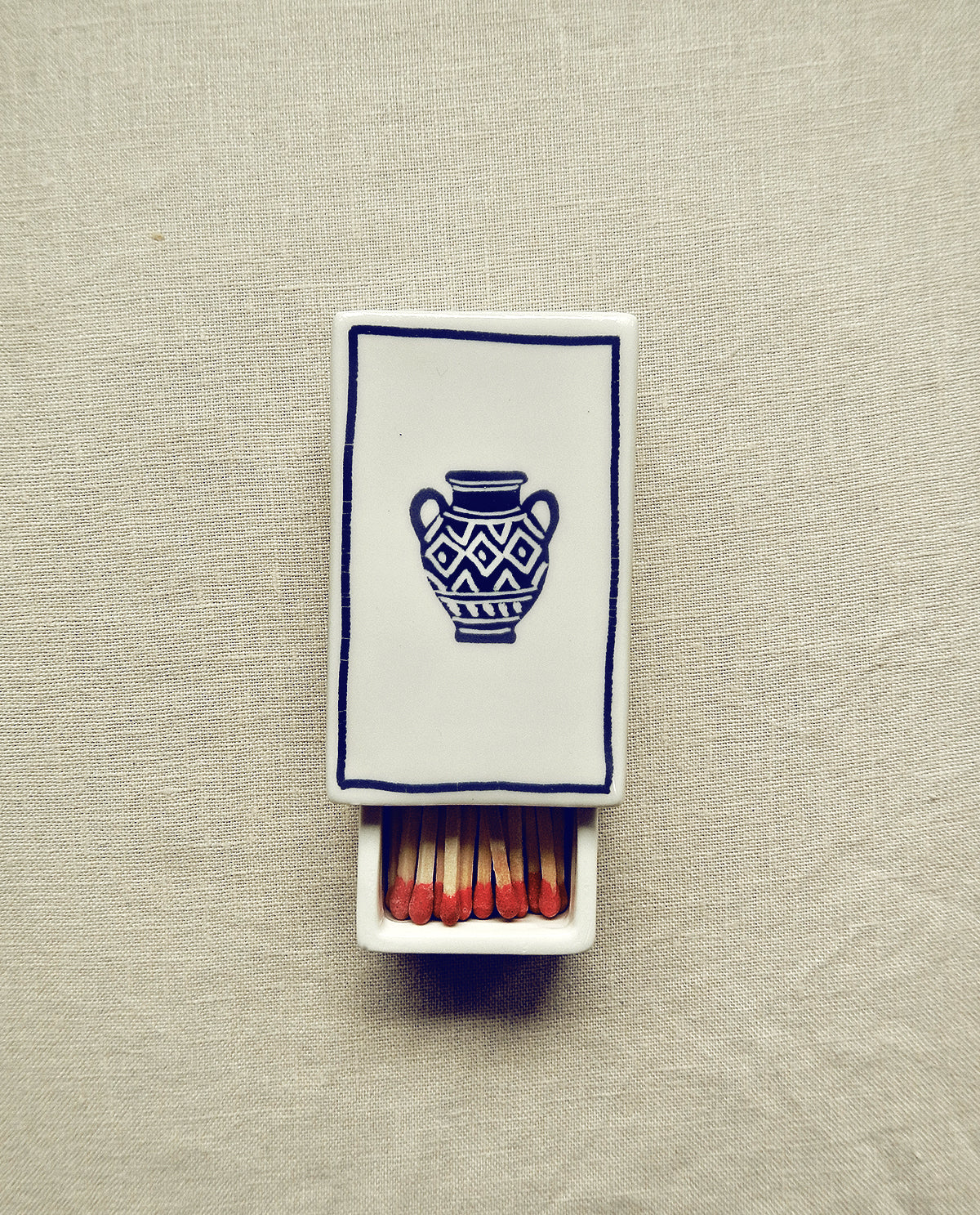 Hand-illustrated ceramic matchbox with greek vase illustration
