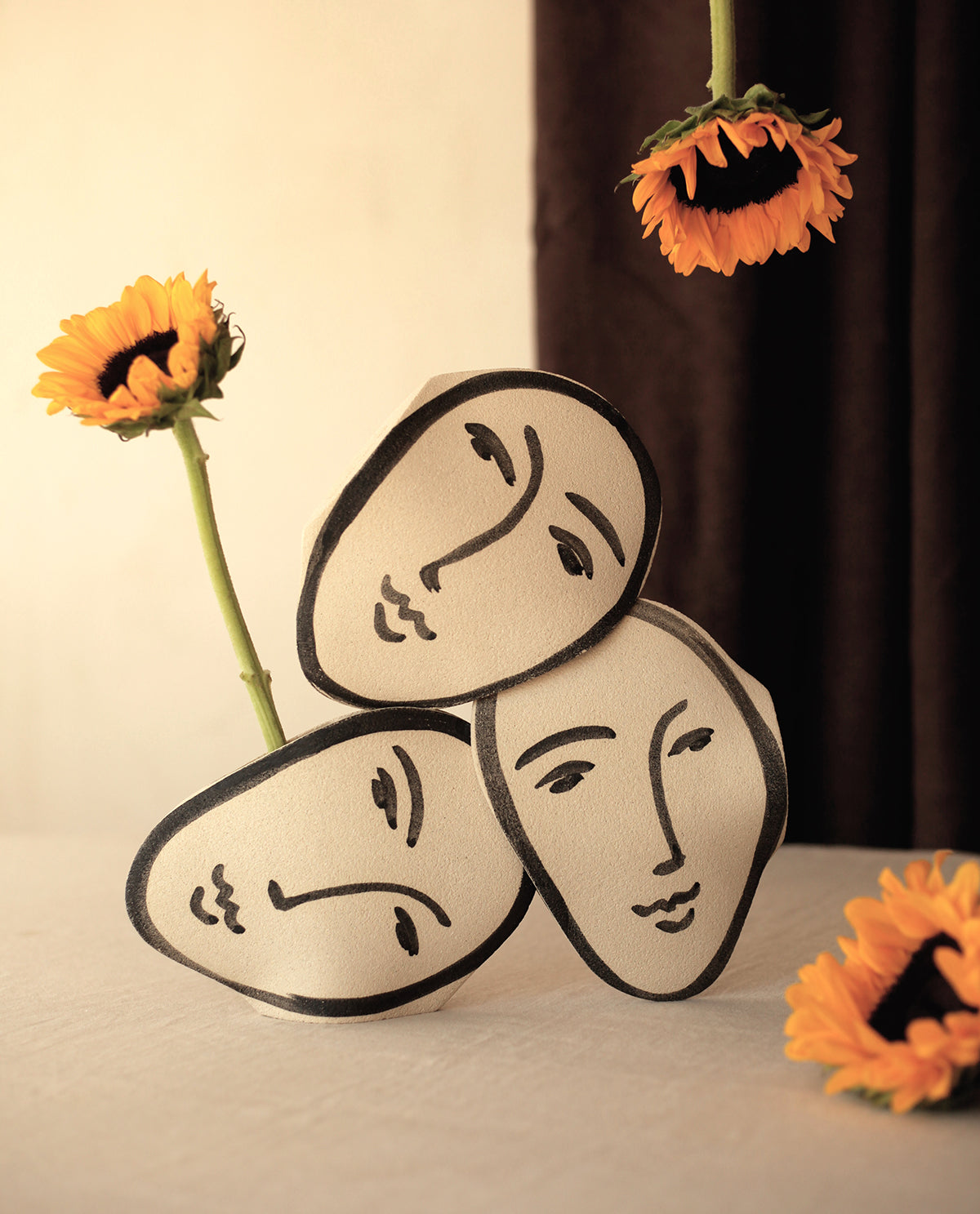 ‘Matisse Face’ Vase - Handmade Stoneware
Inspired by Matisse, this handcrafted stoneware vase features black underglaze motifs on a raw, textured surface. Fired at 1250°C with a transparent glazed interior, each piece is unique, with subtle variations in shape and color.