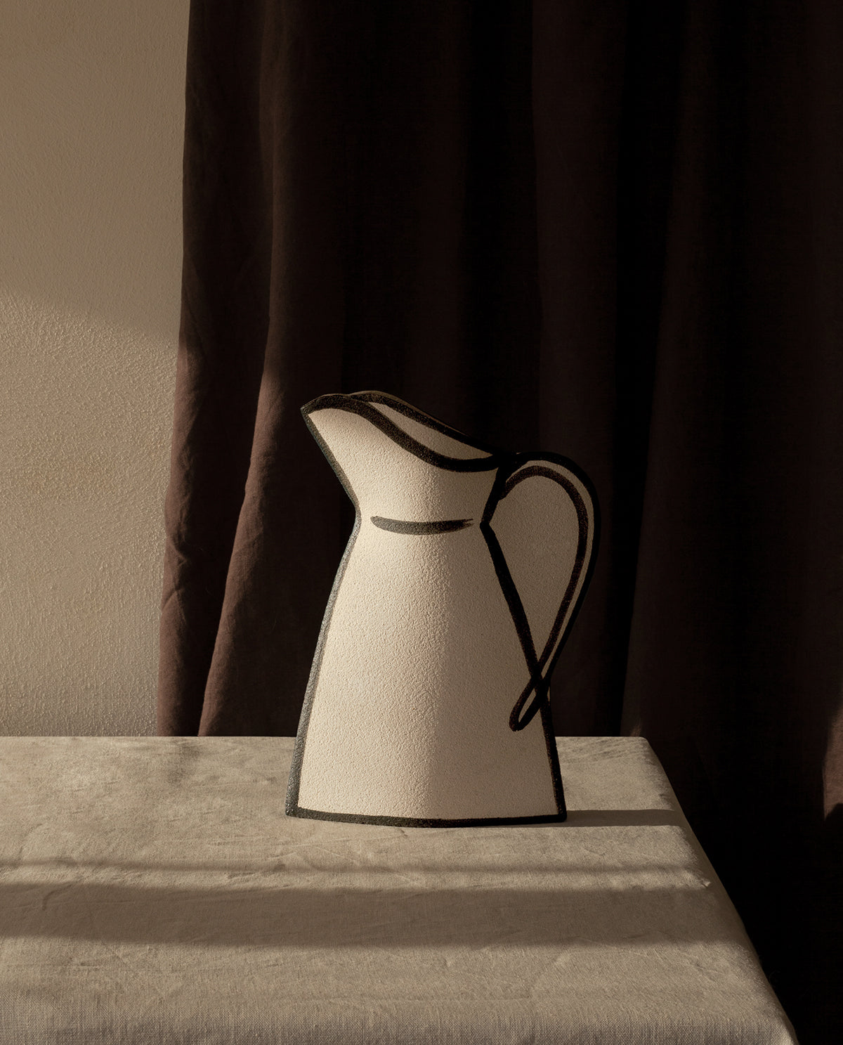 Hand-painted trompe l'oeil vase by INI CERAMIQUE with illustrative patterns and a textured finish