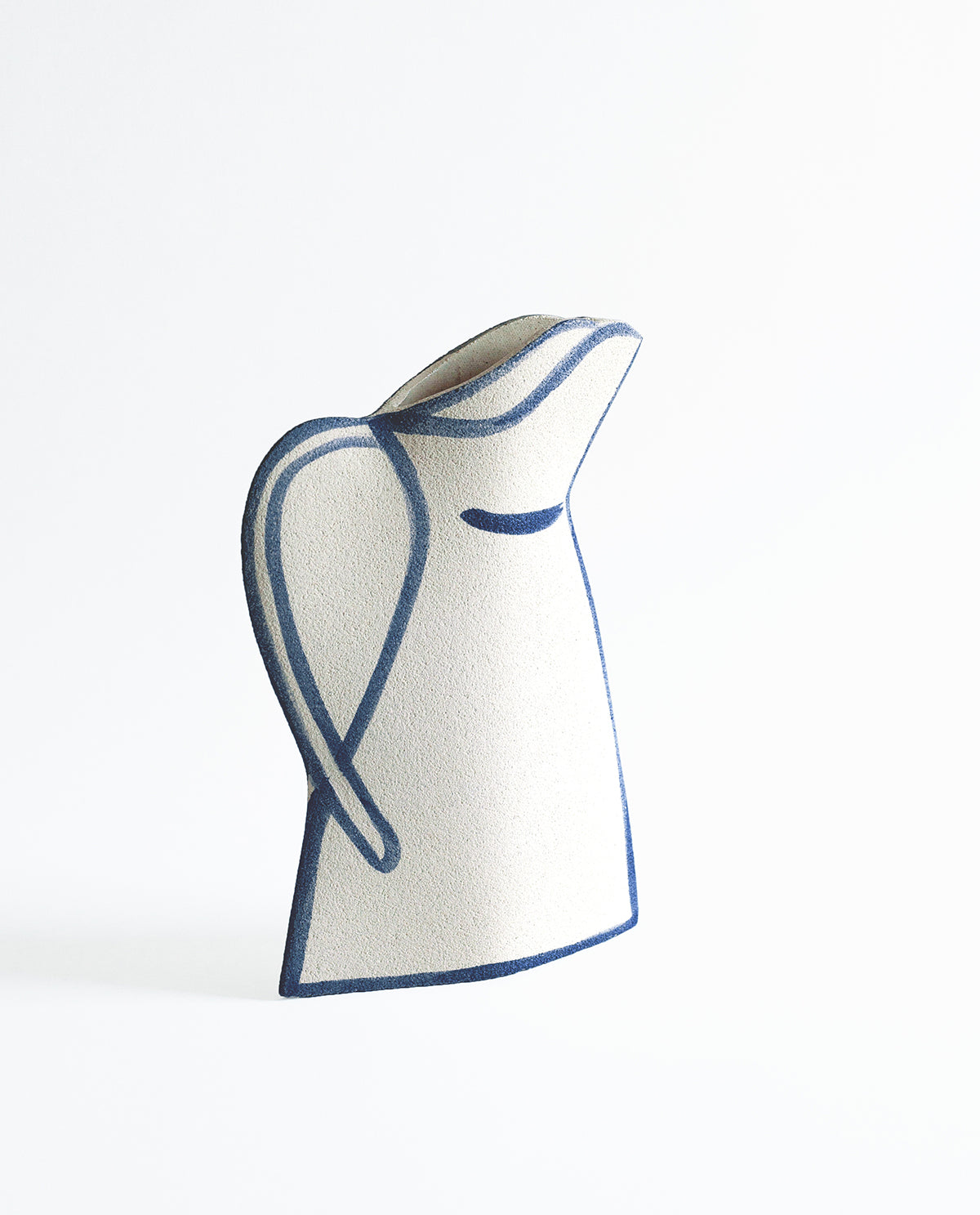 Hand-painted trompe l'oeil vase by INI CERAMIQUE with illustrative patterns and a textured finish