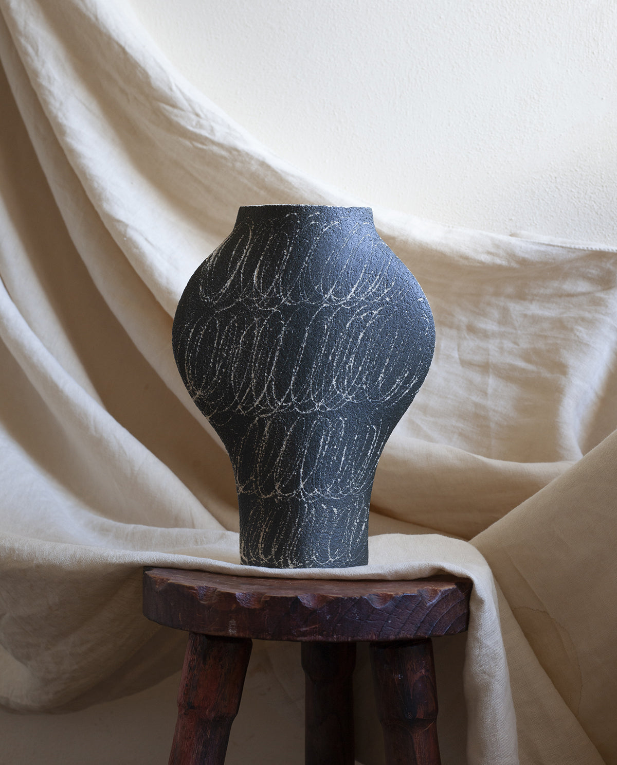 Hand-painted abstract vase by INI CERAMIQUE with geometric patterns and textured finish