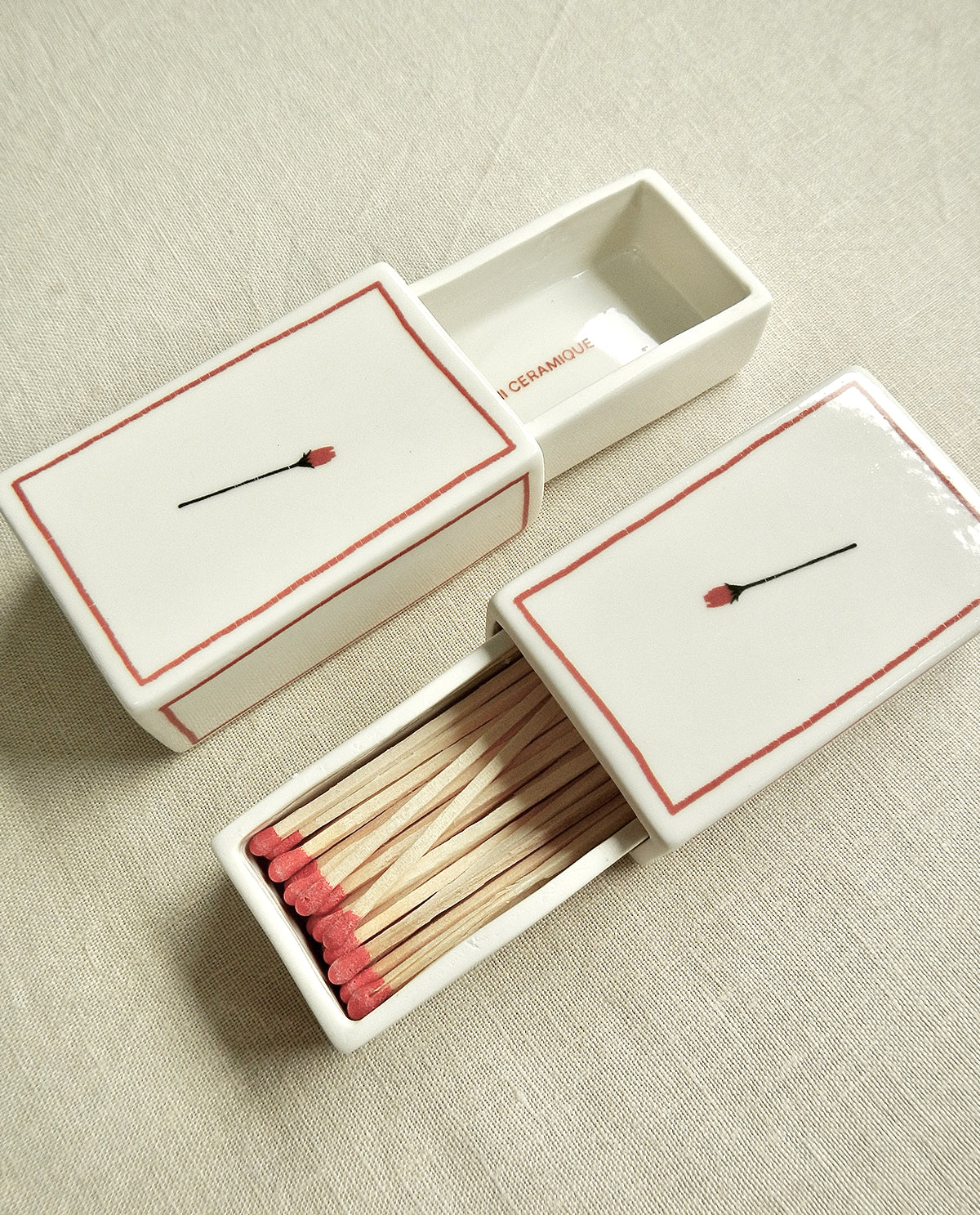 Ceramic matchbox with hand-drawn rose illustration