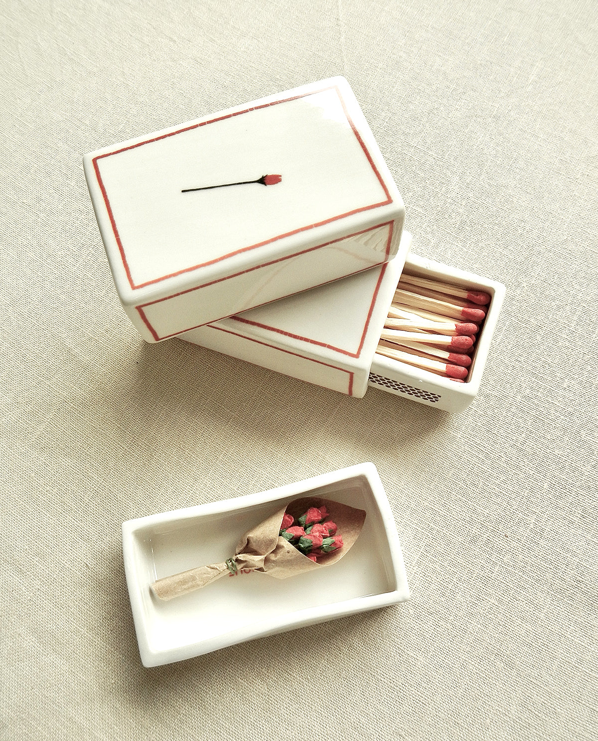 Ceramic matchbox with hand-drawn rose illustration