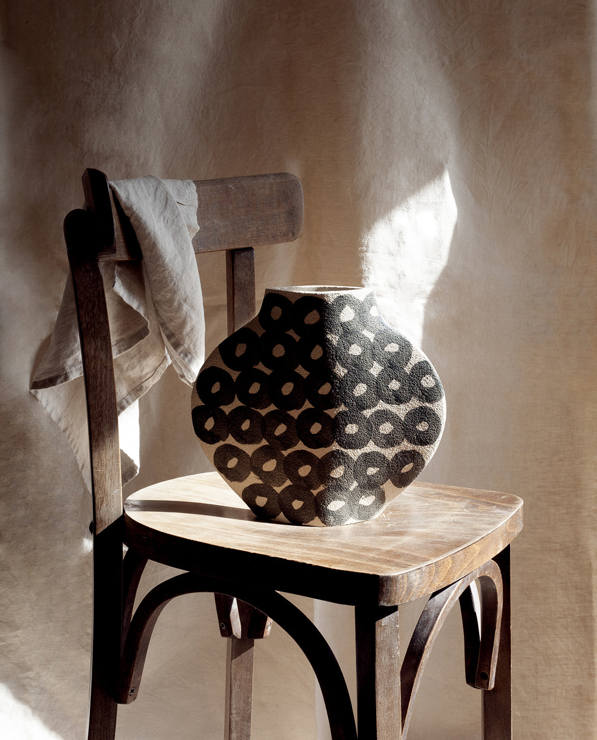 Hand-painted abstract vase by INI CERAMIQUE with geometric patterns and textured finish