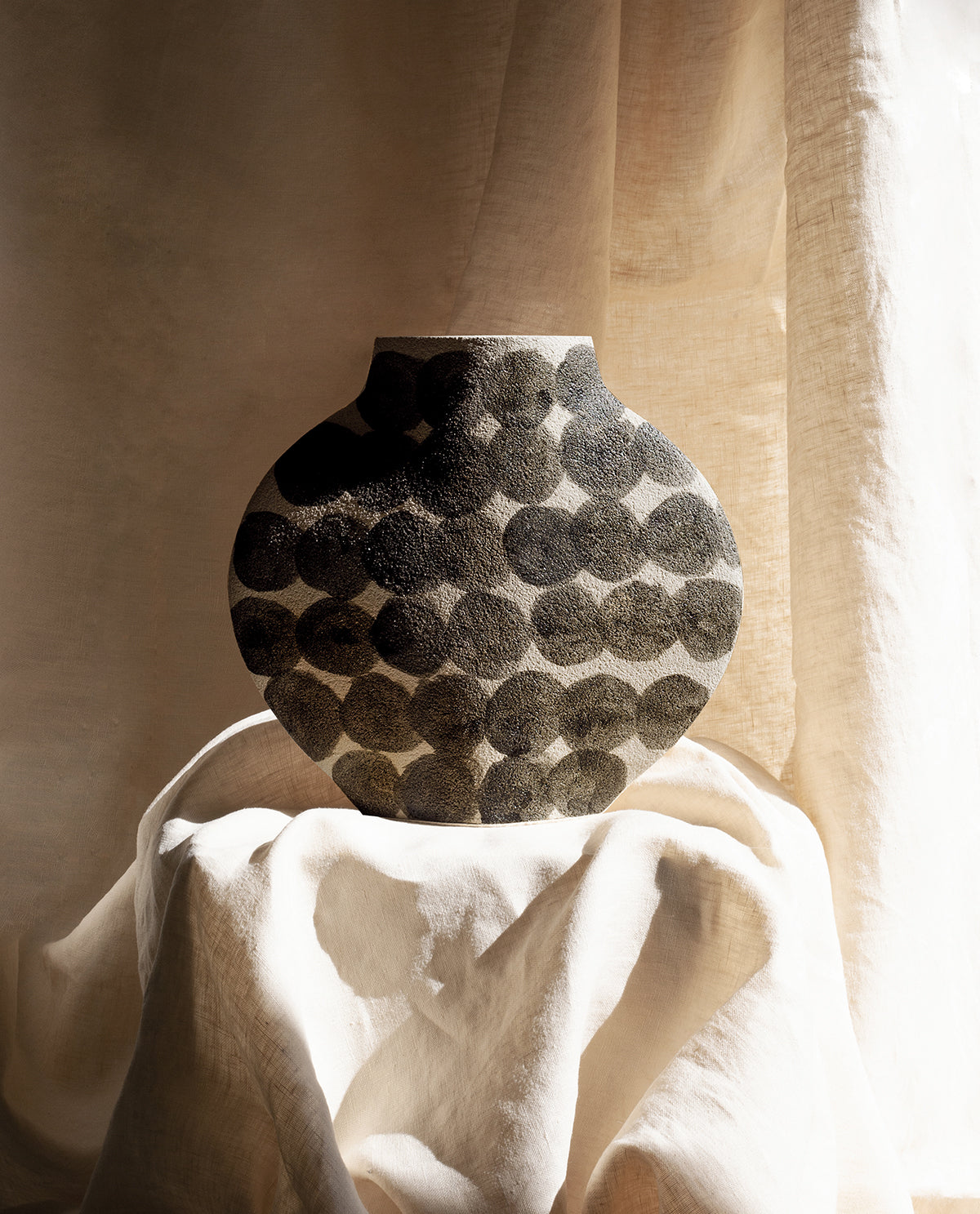Hand-painted abstract vase by INI CERAMIQUE with geometric patterns and textured finish