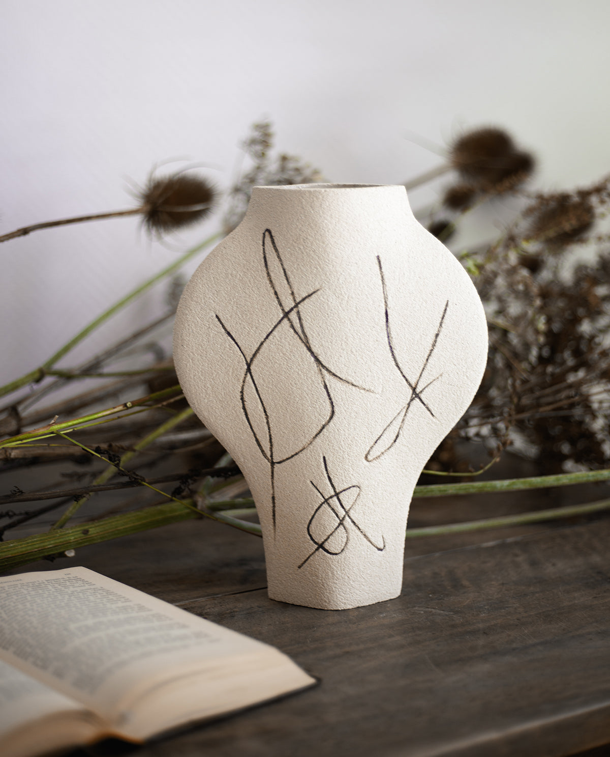 Hand-painted abstract vase by INI CERAMIQUE with carved patterns and textured finish