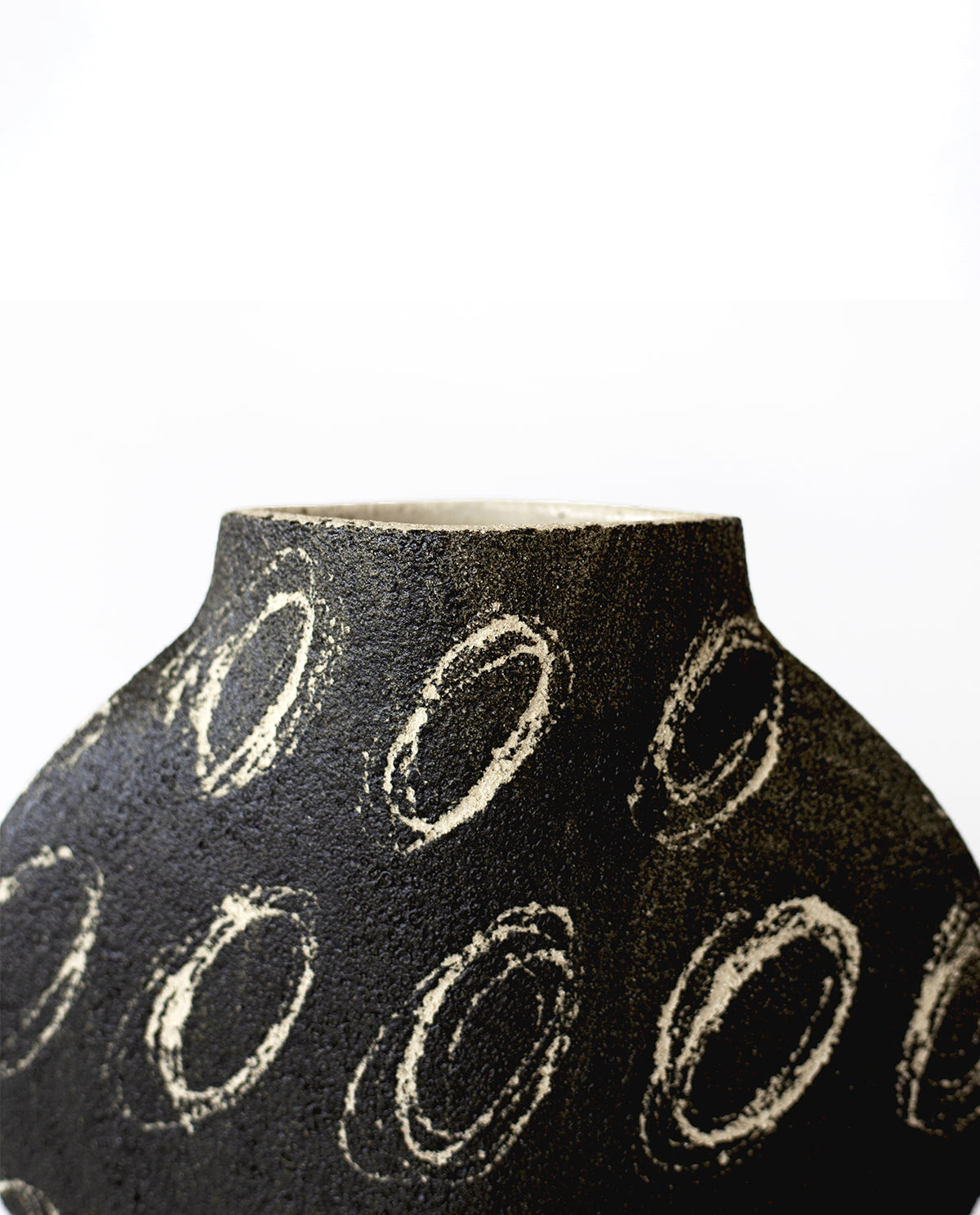 Hand-painted abstract vase by INI CERAMIQUE with geometric patterns and textured finish
