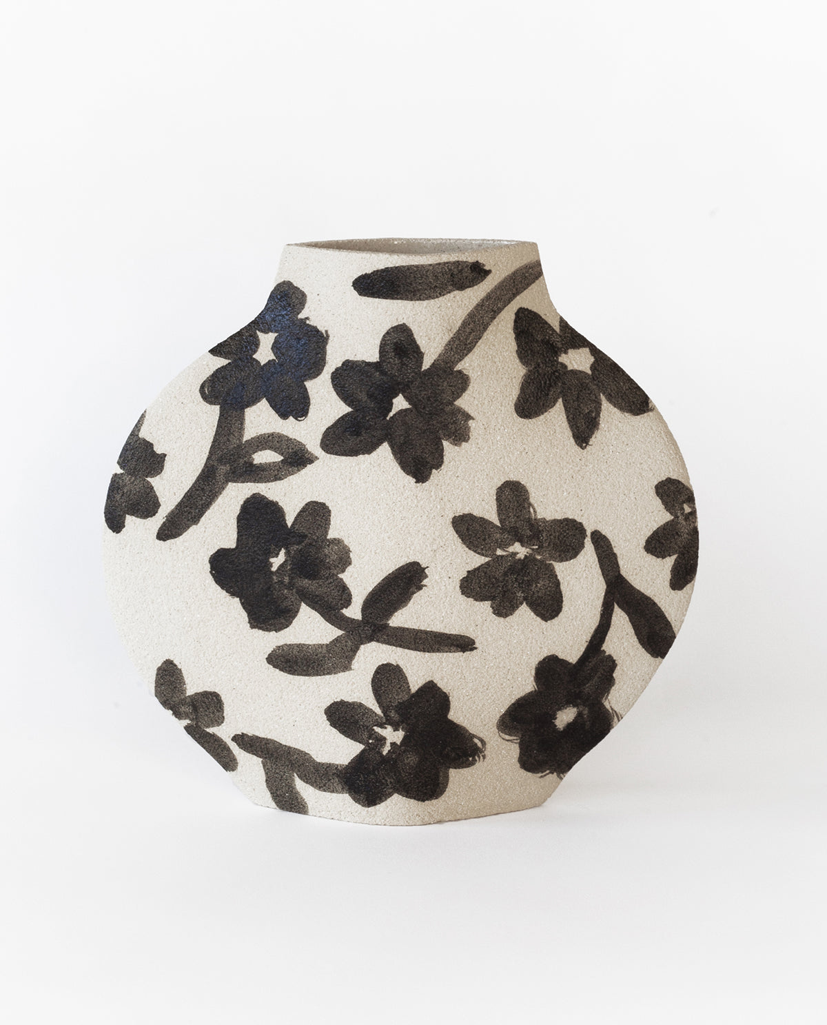 Hand-painted floral vase by INI CERAMIQUE with flowers patterns and textured finish