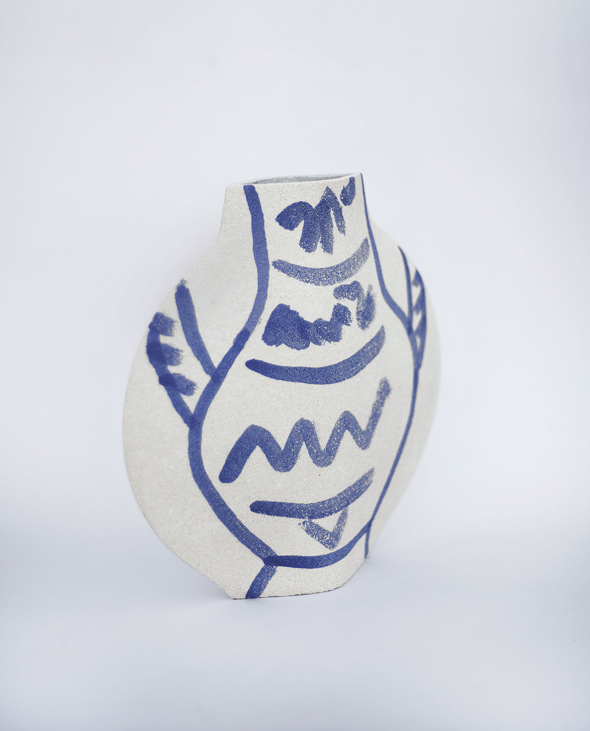 Hand-painted trompe l'oeil vase by INI CERAMIQUE with illustrative patterns and textured finish