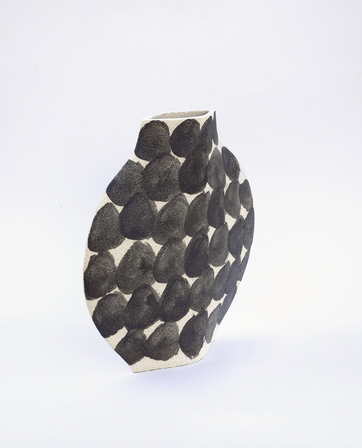 Hand-painted abstract vase by INI CERAMIQUE with geometric round patterns and textured finish