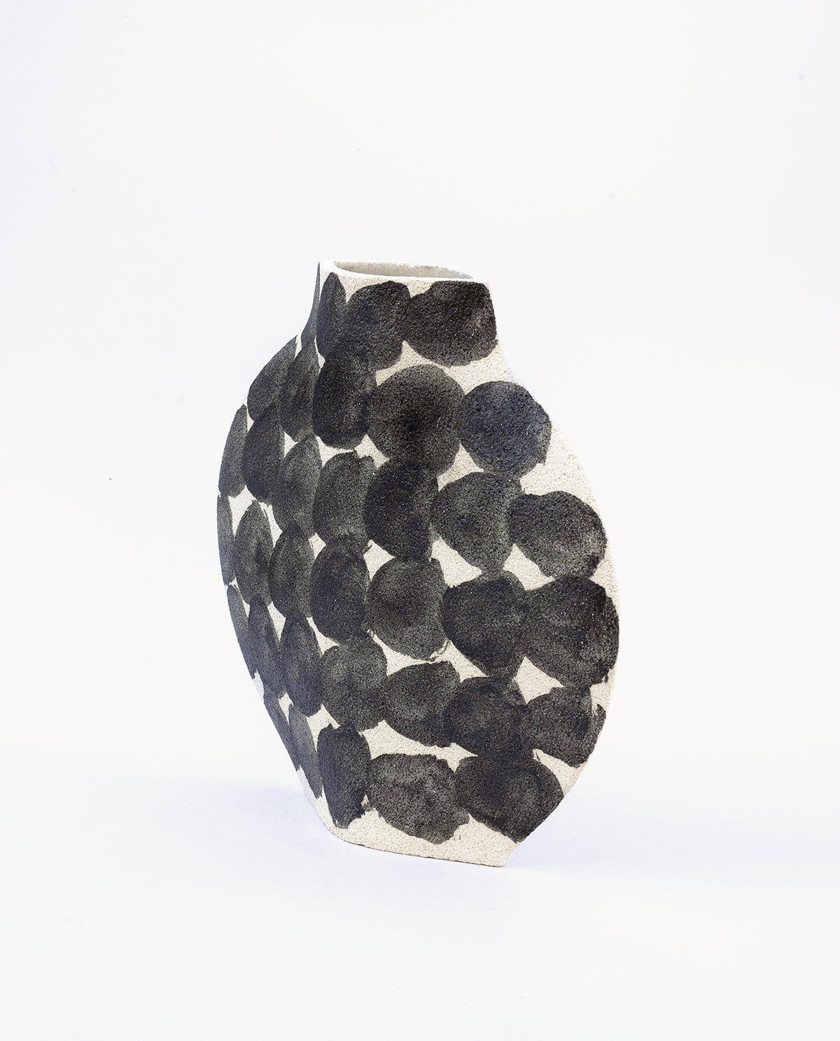 Hand-painted abstract vase by INI CERAMIQUE with geometric round patterns and textured finish