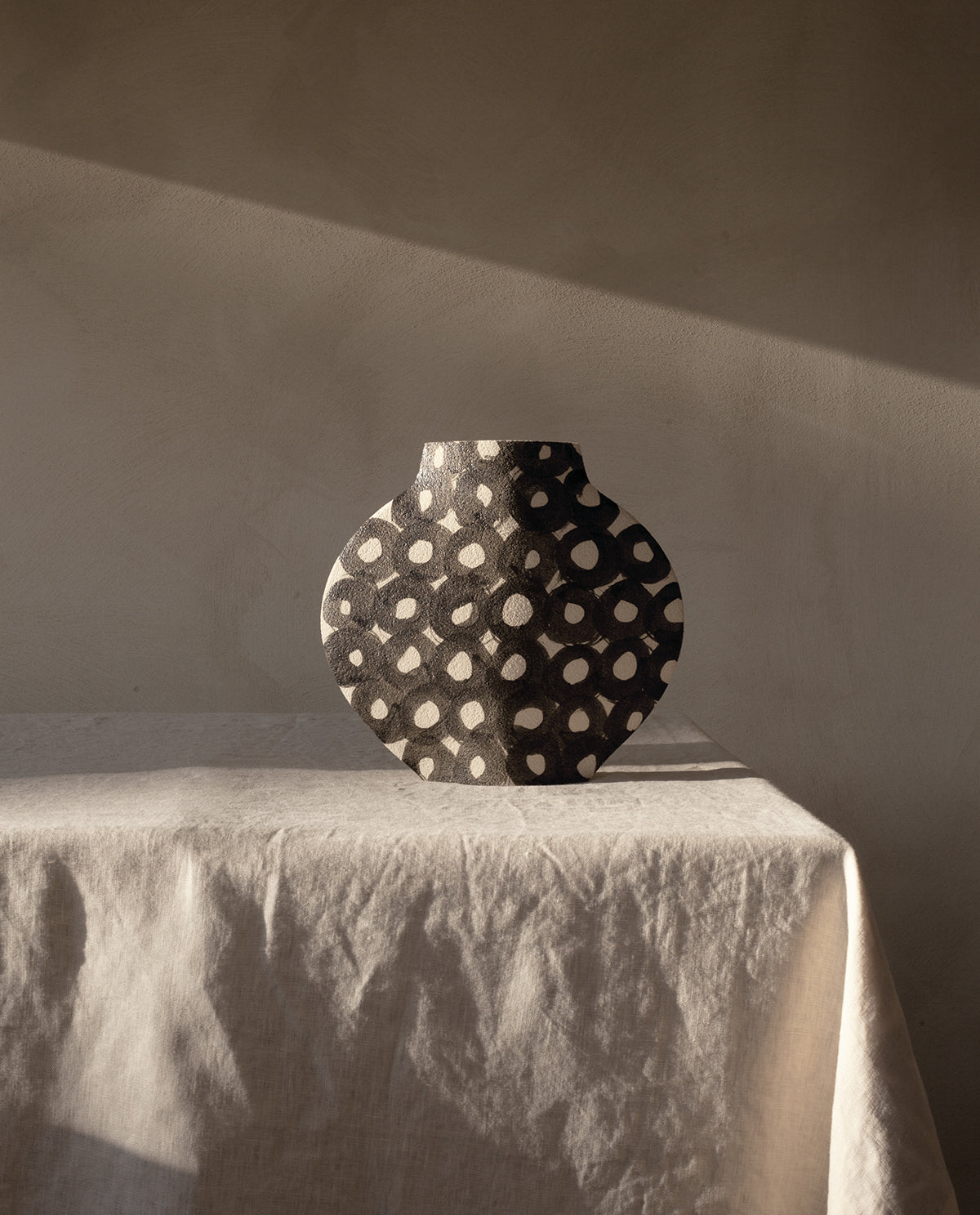 Hand-painted abstract vase by INI CERAMIQUE with geometric patterns and textured finish