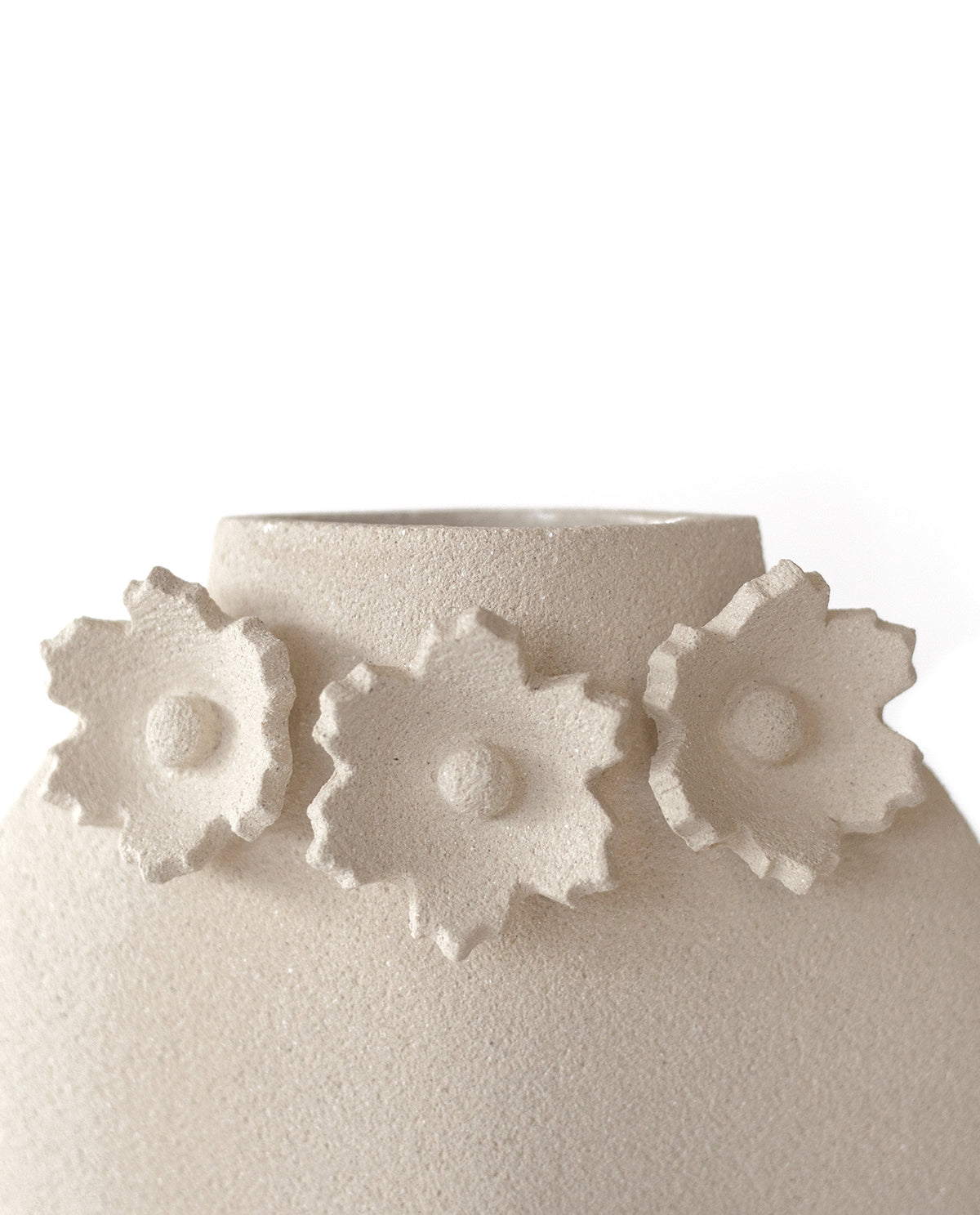 Handmade floral vase by INI CERAMIQUE with flower sculptures and textured finish