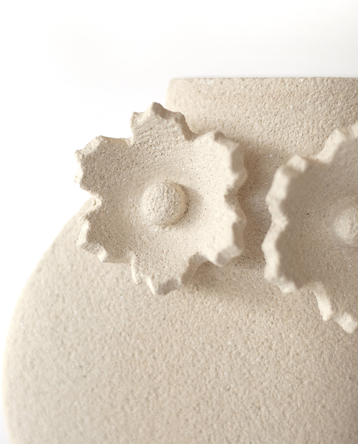 Handmade floral vase by INI CERAMIQUE with flower sculptures and textured finish
