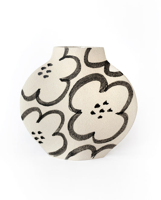 Hand-painted floral vase by INI CERAMIQUE with camellia patterns and a textured finish