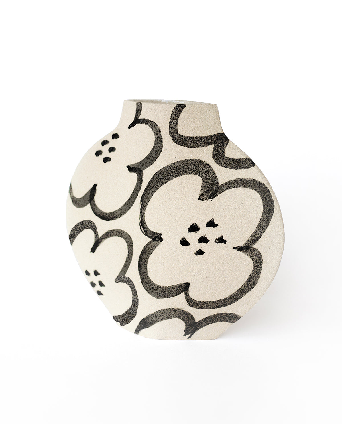 Hand-painted floral vase by INI CERAMIQUE with camellia patterns and a textured finish