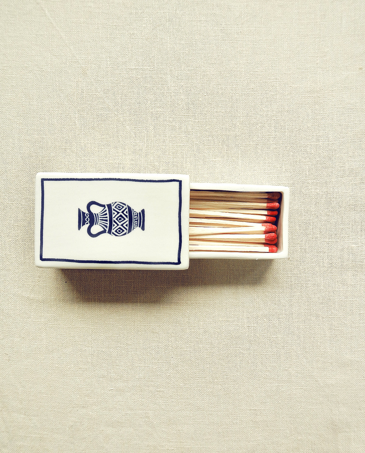 Hand-illustrated ceramic matchbox with amphora illustration