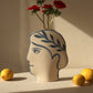 Hand-painted greek vase by INI CERAMIQUE with face patterns and textured finish