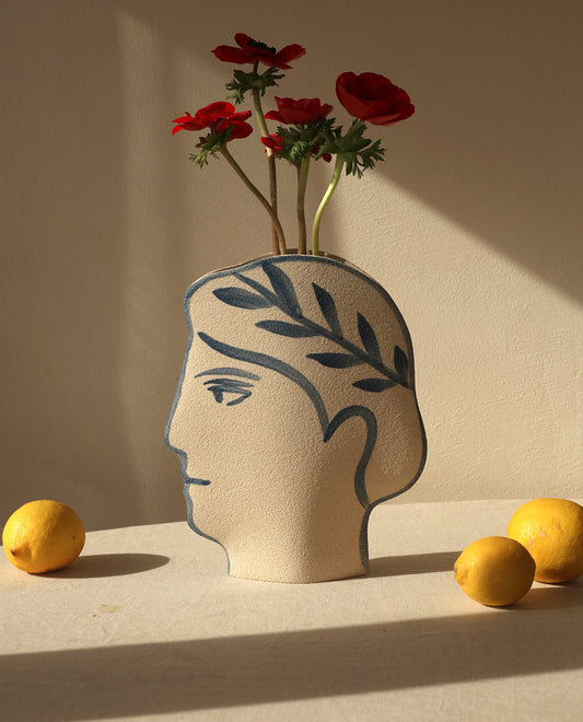 Hand-painted greek vase by INI CERAMIQUE with face patterns and textured finish