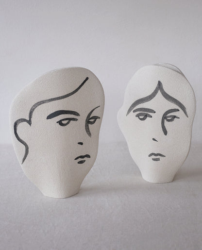 Hand-painted face vase by INI CERAMIQUE with illustrative patterns and a textured finish