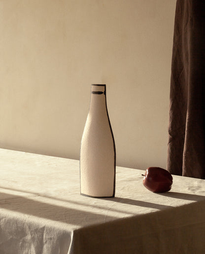 Hand-painted trompe l'oeil vase by INI CERAMIQUE with illustrative patterns and a textured finish