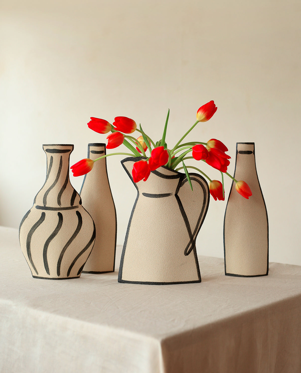 Hand-painted trompe l'oeil vase by INI CERAMIQUE with illustrative patterns and a textured finish