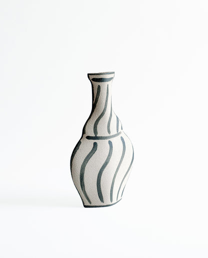 Hand-painted trompe l'oeil vase by INI CERAMIQUE with illustrative patterns and a textured finish