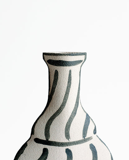 Hand-painted trompe l'oeil vase by INI CERAMIQUE with illustrative patterns and a textured finish