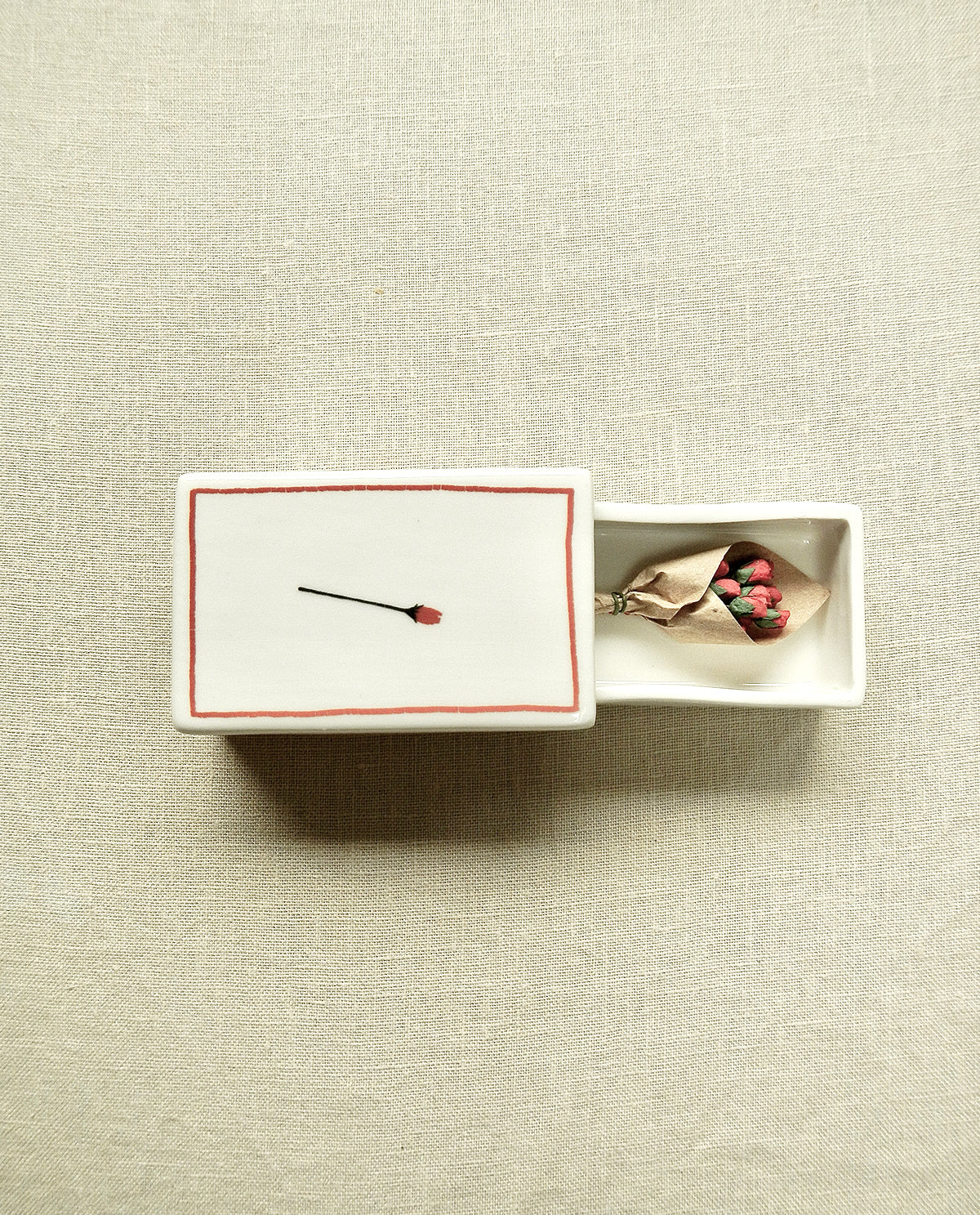 Ceramic matchbox with hand-drawn rose illustration