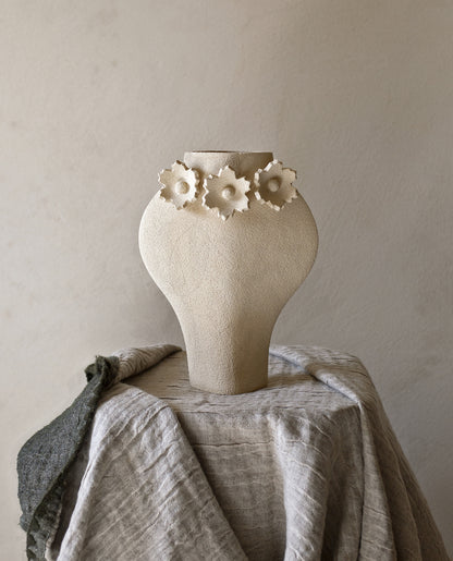 Handmade floral vase by INI CERAMIQUE with flower sculptures and textured finish