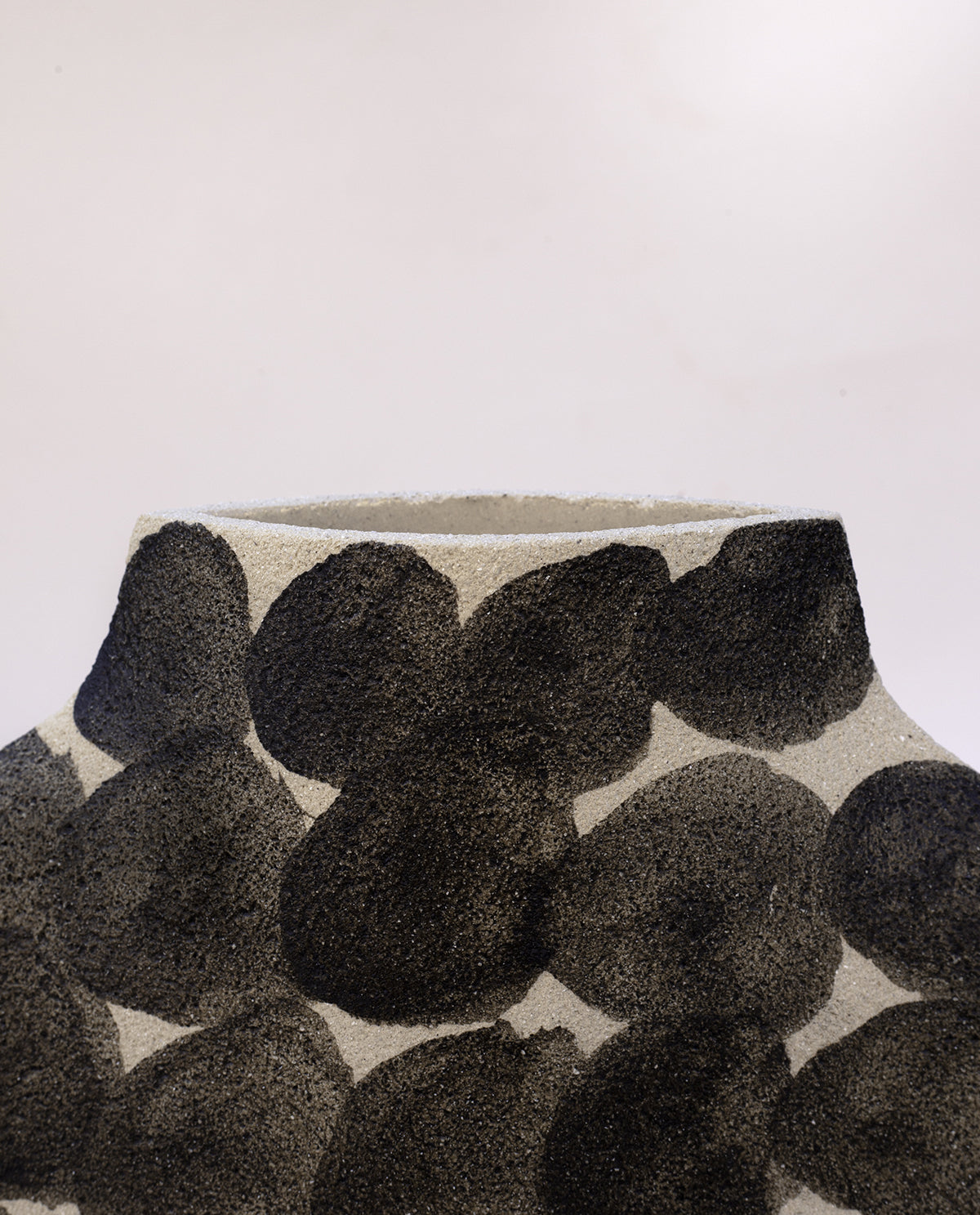 Hand-painted abstract vase by INI CERAMIQUE with geometric round patterns and textured finish